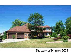 1 Golf Club Road Moscow, PA 18436 - Photo 4 of 5 a house view with a garden space