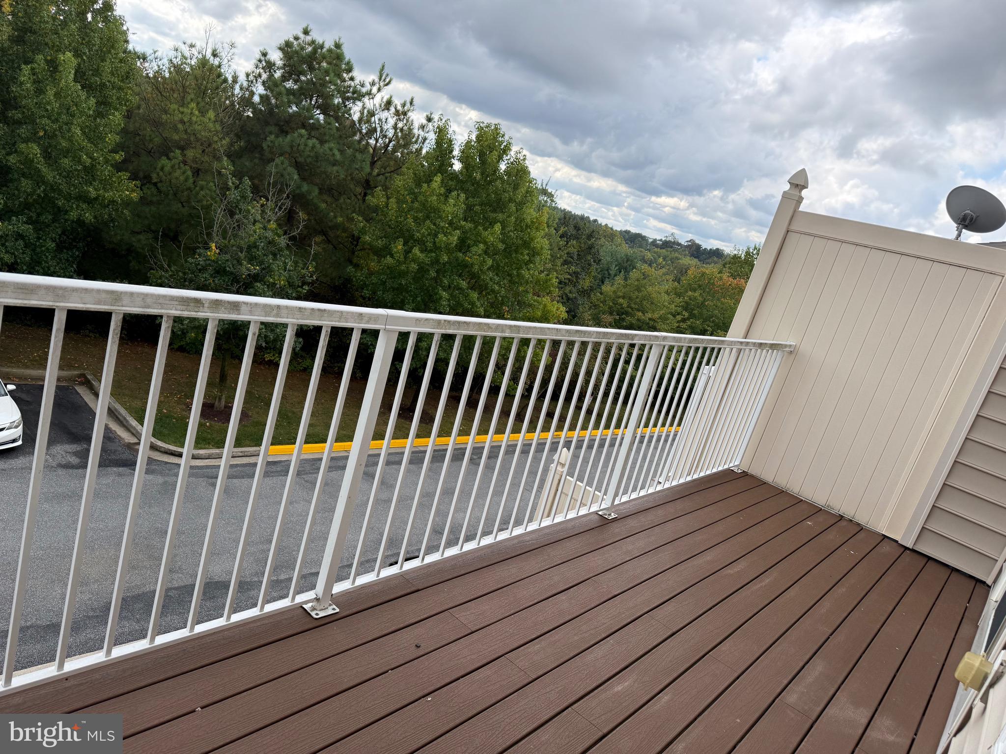 11039 Mill Centre Drive, Unit 11039 Owings Mills, MD 21117 - Photo 18 of 33 a view of balcony with wooden floor