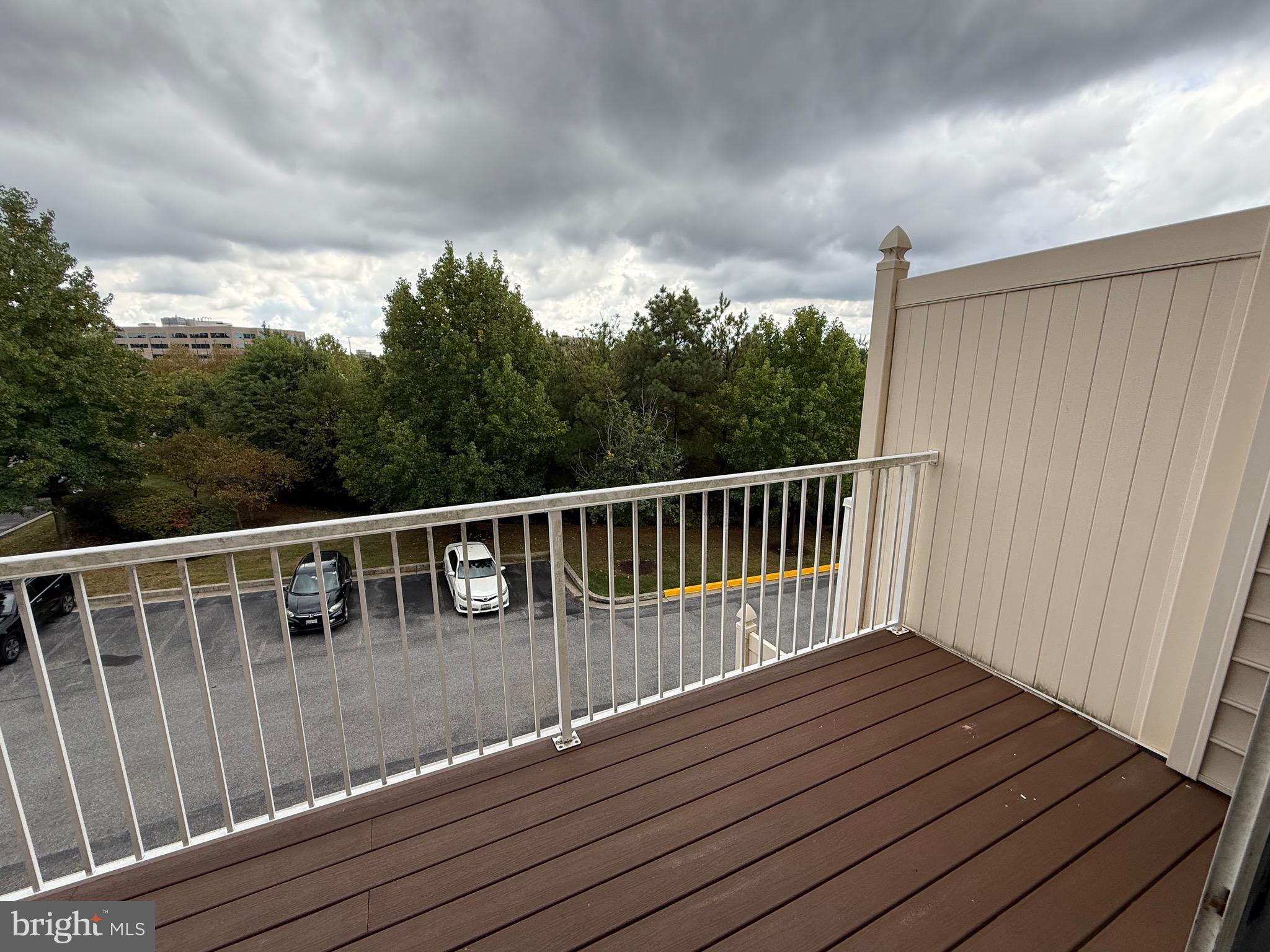 11039 Mill Centre Drive, Unit 11039 Owings Mills, MD 21117 - Photo 20 of 33 a balcony with wooden floor