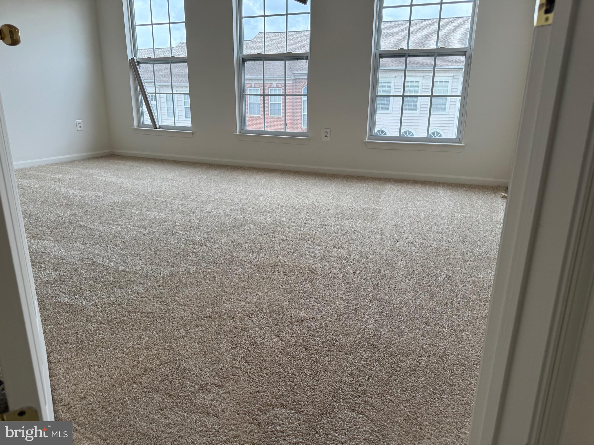 11039 Mill Centre Drive, Unit 11039 Owings Mills, MD 21117 - Photo 22 of 33 an empty room with windows