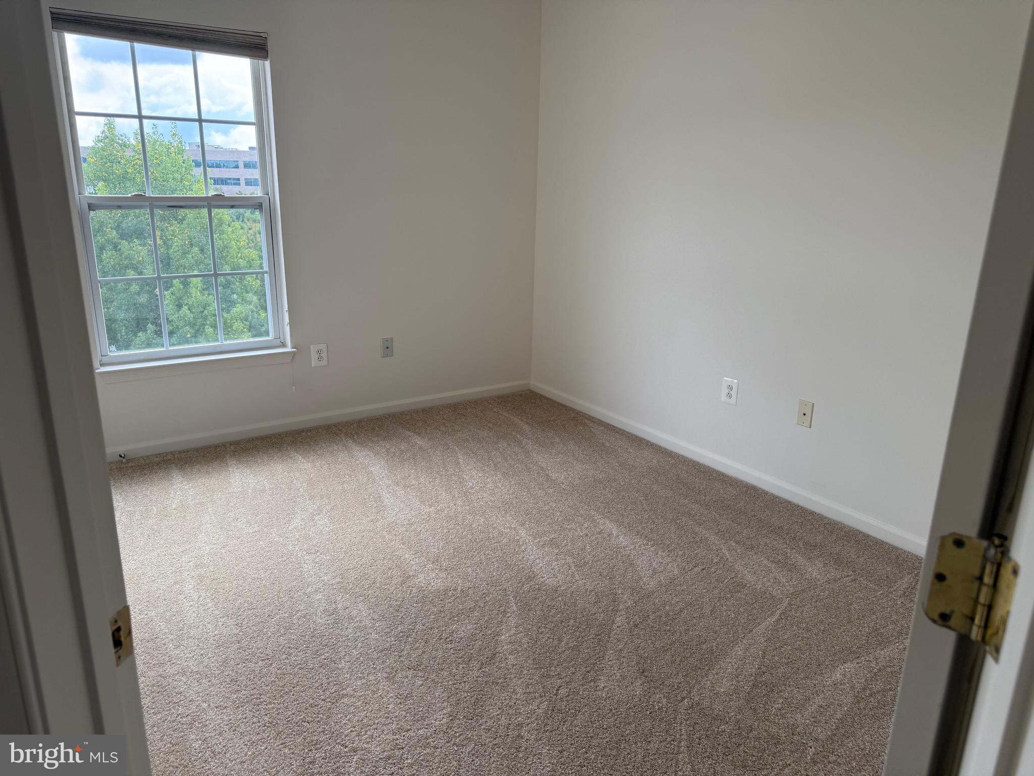 11039 Mill Centre Drive, Unit 11039 Owings Mills, MD 21117 - Photo 27 of 33 an empty room with a window
