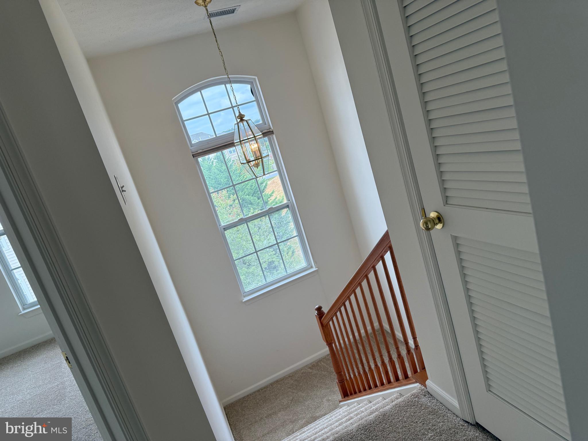 11039 Mill Centre Drive, Unit 11039 Owings Mills, MD 21117 - Photo 29 of 33 a view of a hallway with windows