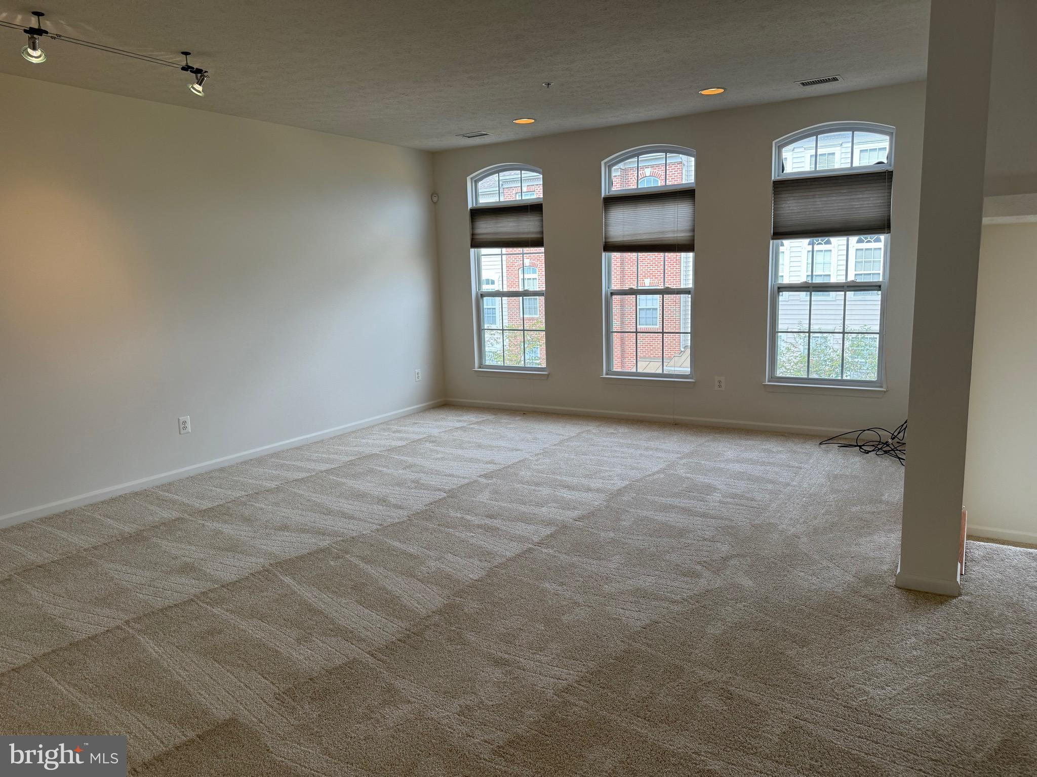 11039 Mill Centre Drive, Unit 11039 Owings Mills, MD 21117 - Photo 7 of 33 an empty room with windows