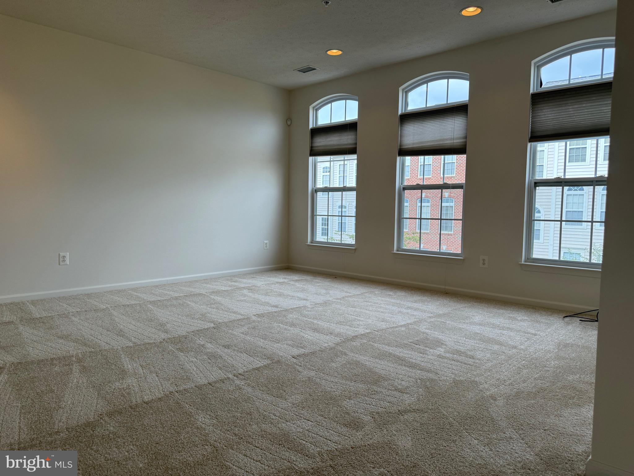 11039 Mill Centre Drive, Unit 11039 Owings Mills, MD 21117 - Photo 9 of 33 an empty room with windows and cabinet