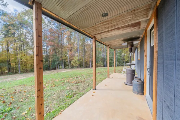 a view of a house with a yard covered with snow