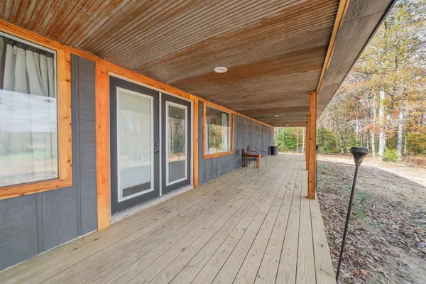 a front view of a house with a yard and porch