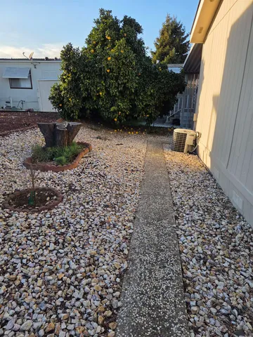 a backyard of a house with lots of green space