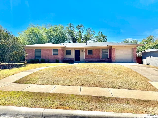 a view of swimming pool with a yard