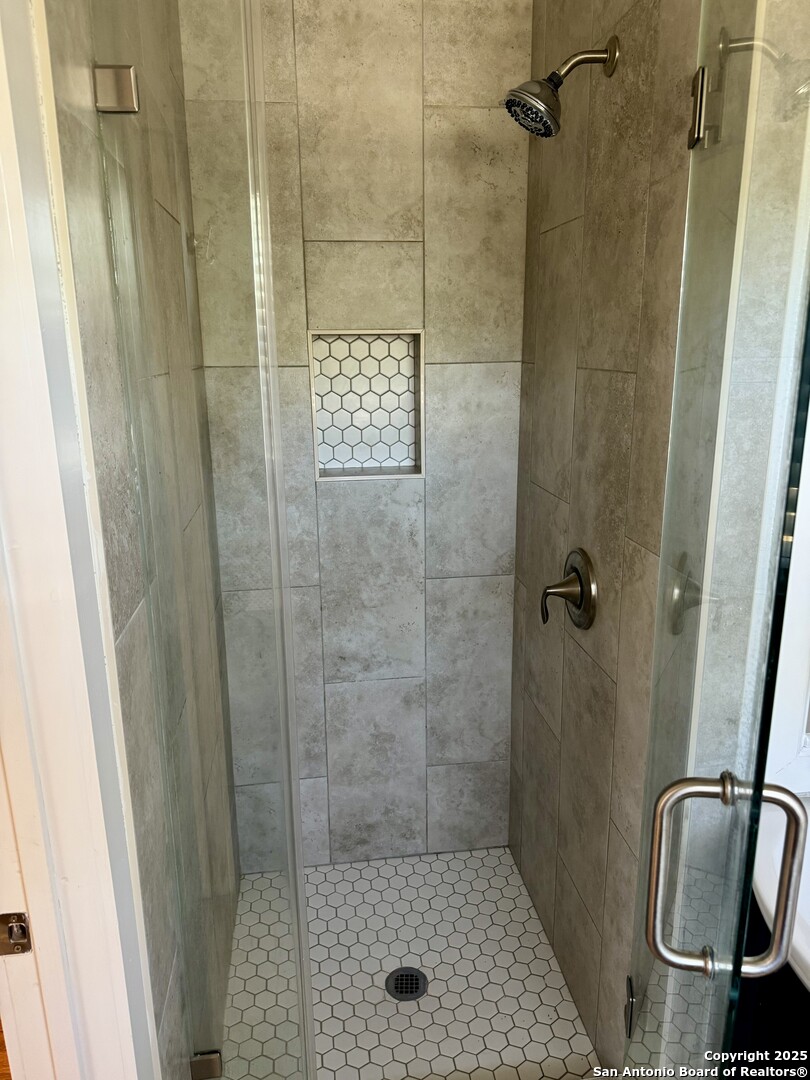 410 Shannon Lee Street San Antonio, TX 78216 - Photo 17 of 19 a bathroom with a shower