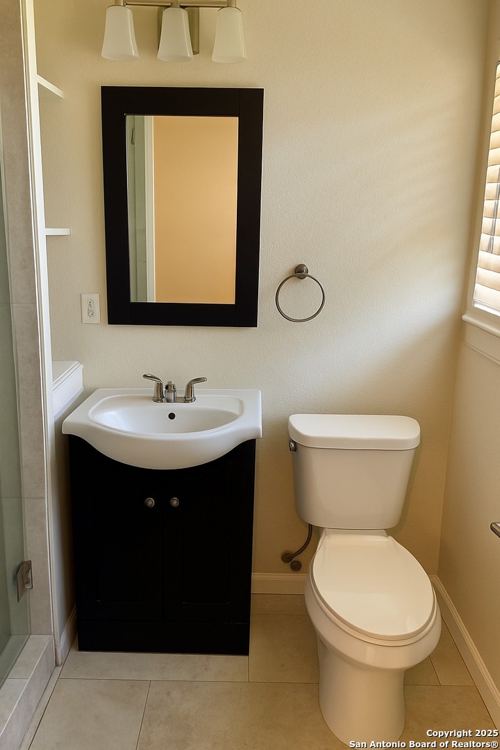 410 Shannon Lee Street San Antonio, TX 78216 - Photo 18 of 19 a bathroom with a sink and a toilet
