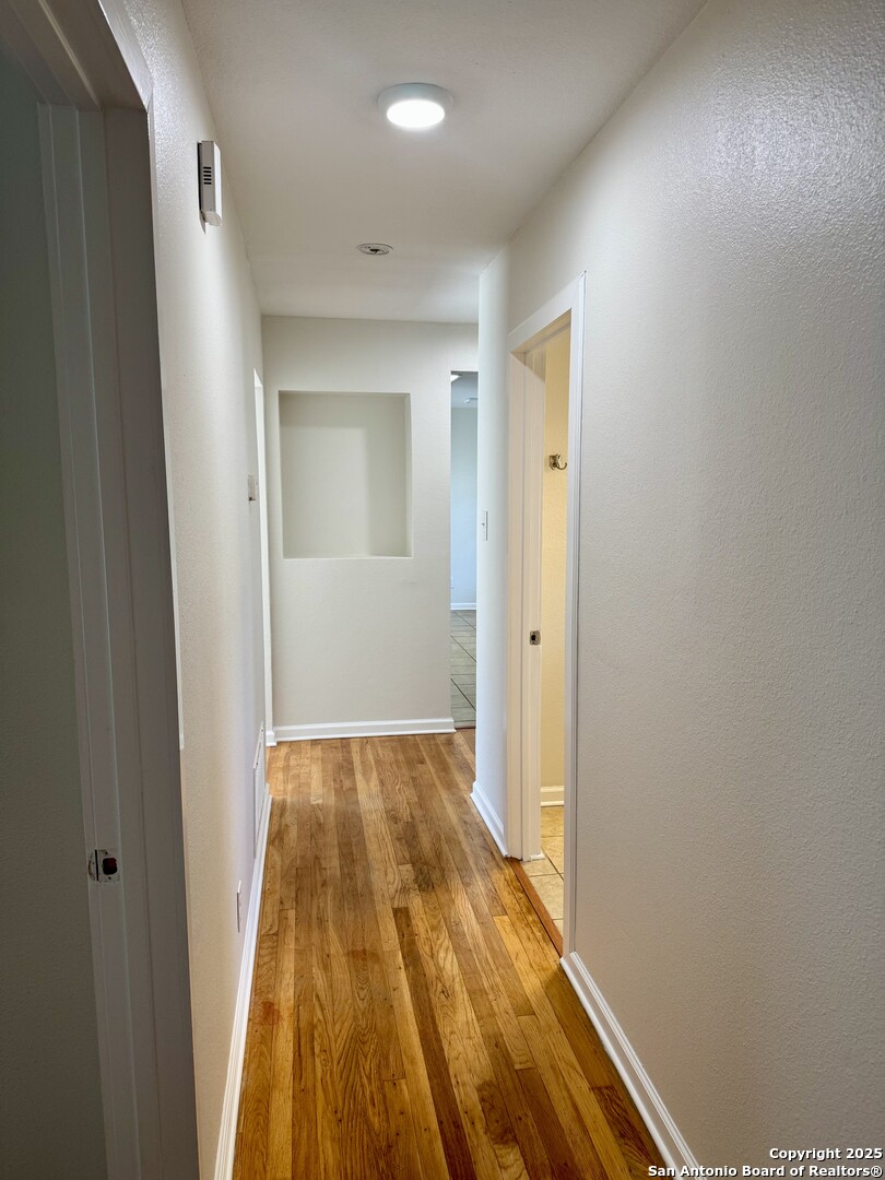 410 Shannon Lee Street San Antonio, TX 78216 - Photo 4 of 19 a view of hallway with wooden floor
