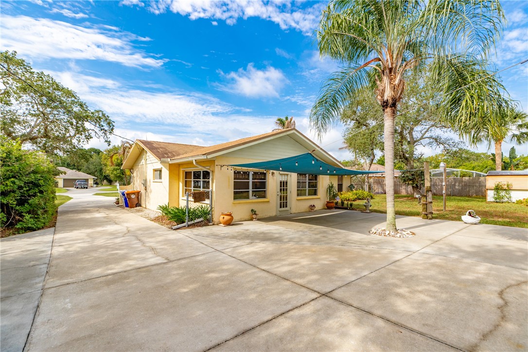 7666 134th Street Sebastian, FL 32958 - Photo 3 of 35 a view of a house with outdoor space and tree s