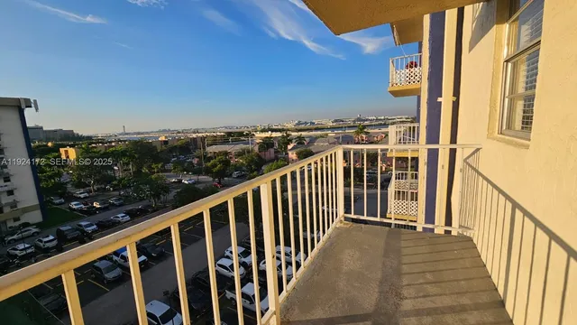 a view of a house with a tree
