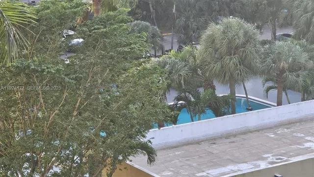 a couple of cars parked in front of a building