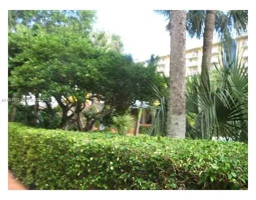 a backyard view with a seating space