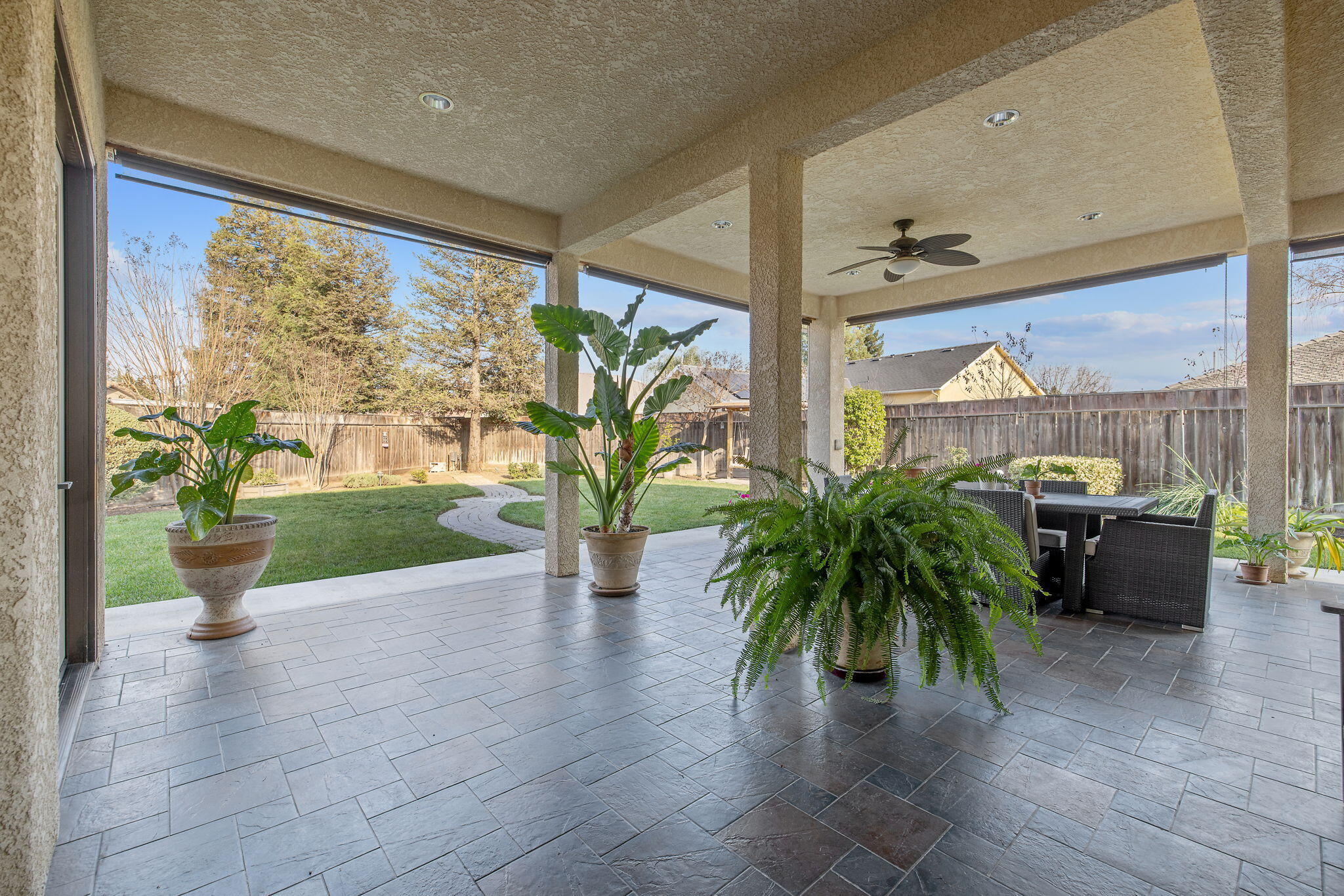 729 St Thomas Court Exeter, CA 93221 - Photo 46 of 66 a view of a porch with chairs and potted plants