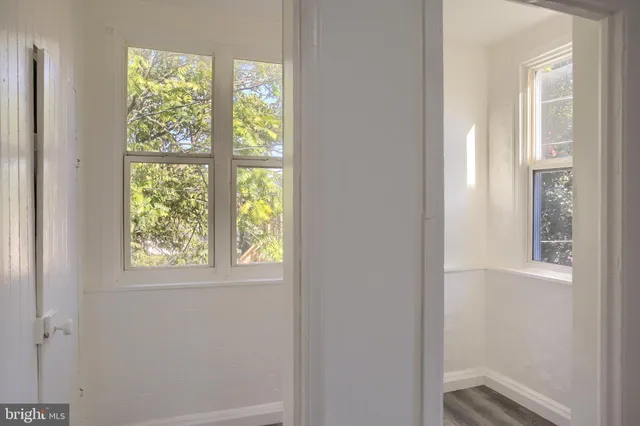 a view of an empty room with a window