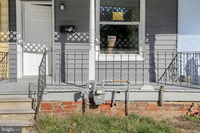 a view of front door and outdoor seating