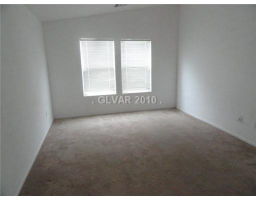 8757 Roping Rodeo Avenue, Unit 101 Las Vegas, NV 89178 - Photo 7 of 10 Master Bedroom.