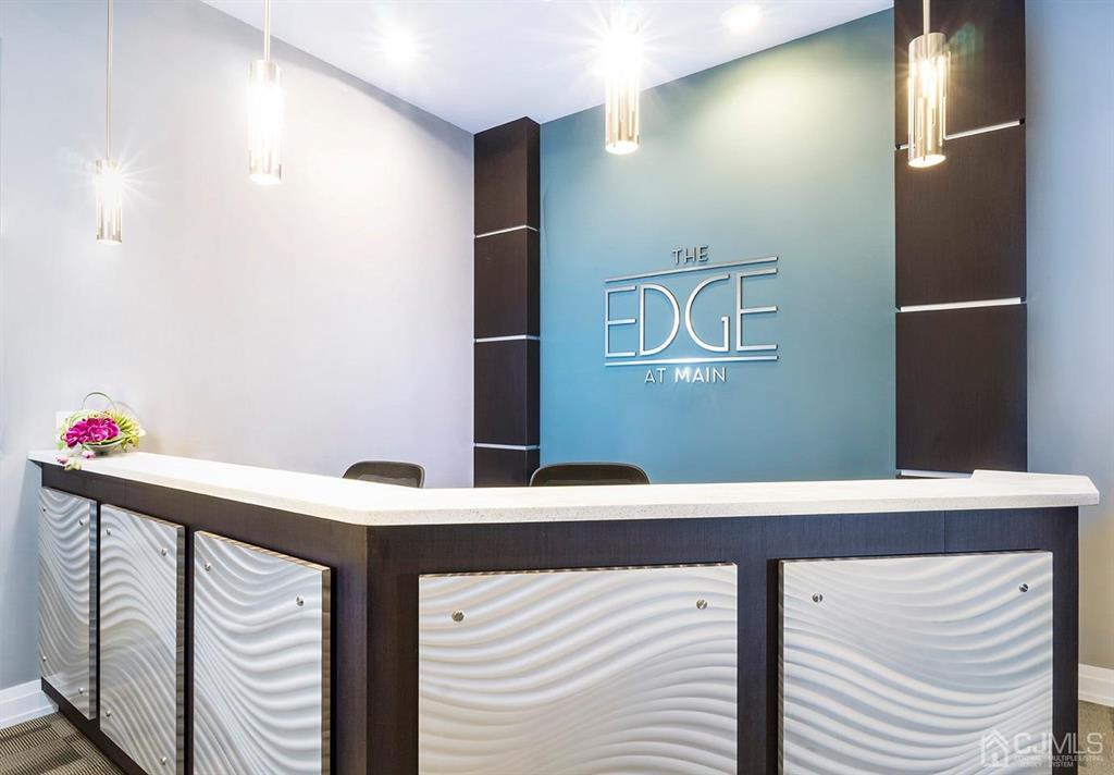 125 West Main Street, Unit 321 Somerville, NJ 08876 - Photo 2 of 17 a bathroom with a sink and a mirror