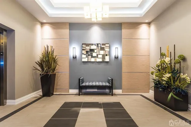 a living room with furniture kitchen and a table