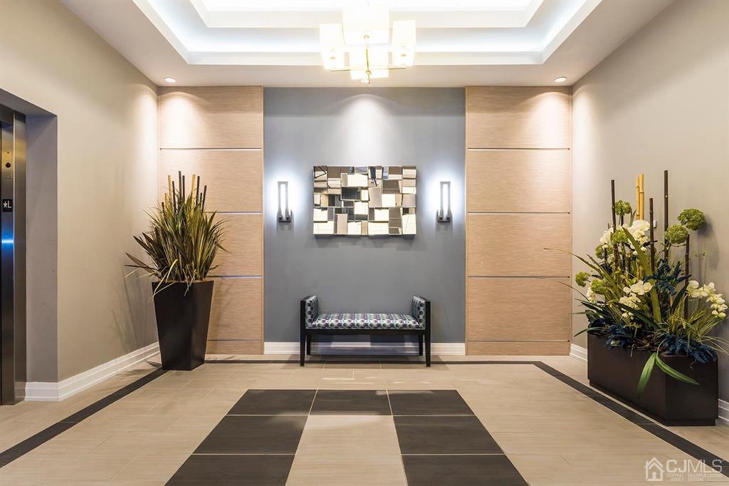 125 West Main Street, Unit 321 Somerville, NJ 08876 - Photo 10 of 17 a bathroom with a sink and a mirror