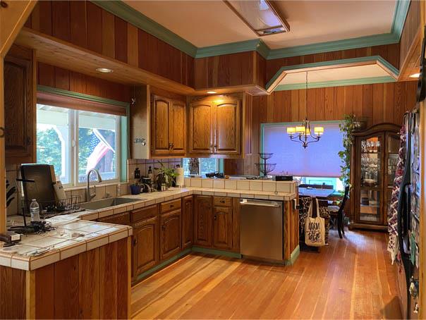 1800 Tucker Road Scotts Valley, CA 95066 - Photo 19 of 33 a kitchen with stainless steel appliances granite countertop a sink a stove and a wooden floors