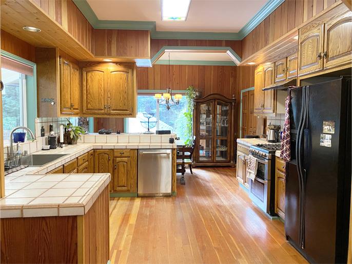 1800 Tucker Road Scotts Valley, CA 95066 - Photo 20 of 33 a kitchen with a sink a counter top space stainless steel appliances and cabinets