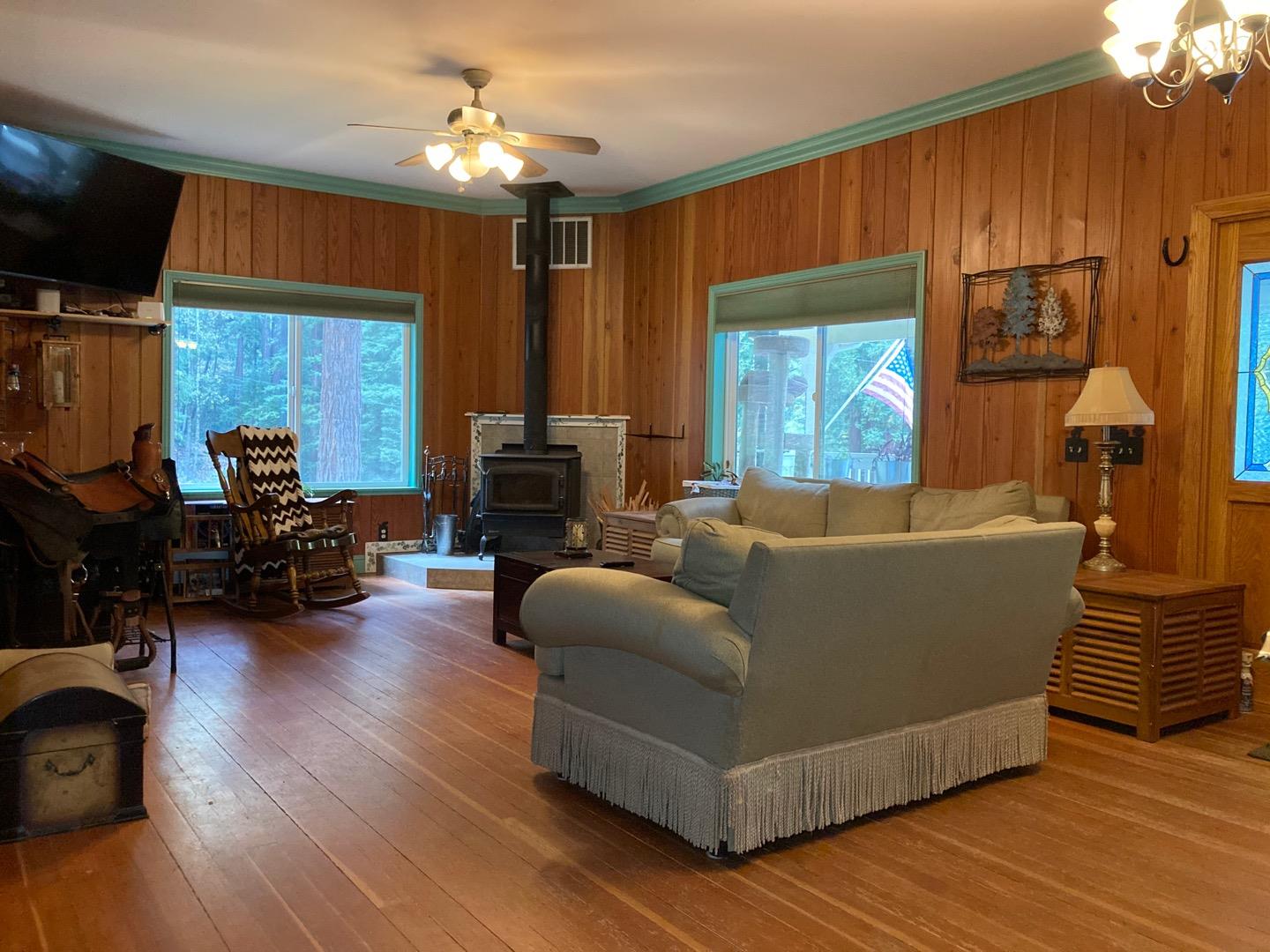 1800 Tucker Road Scotts Valley, CA 95066 - Photo 22 of 33 a living room with furniture a fireplace and a flat screen tv
