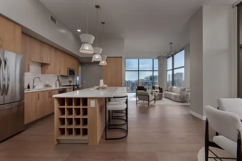 a view of a dining room with furniture and window