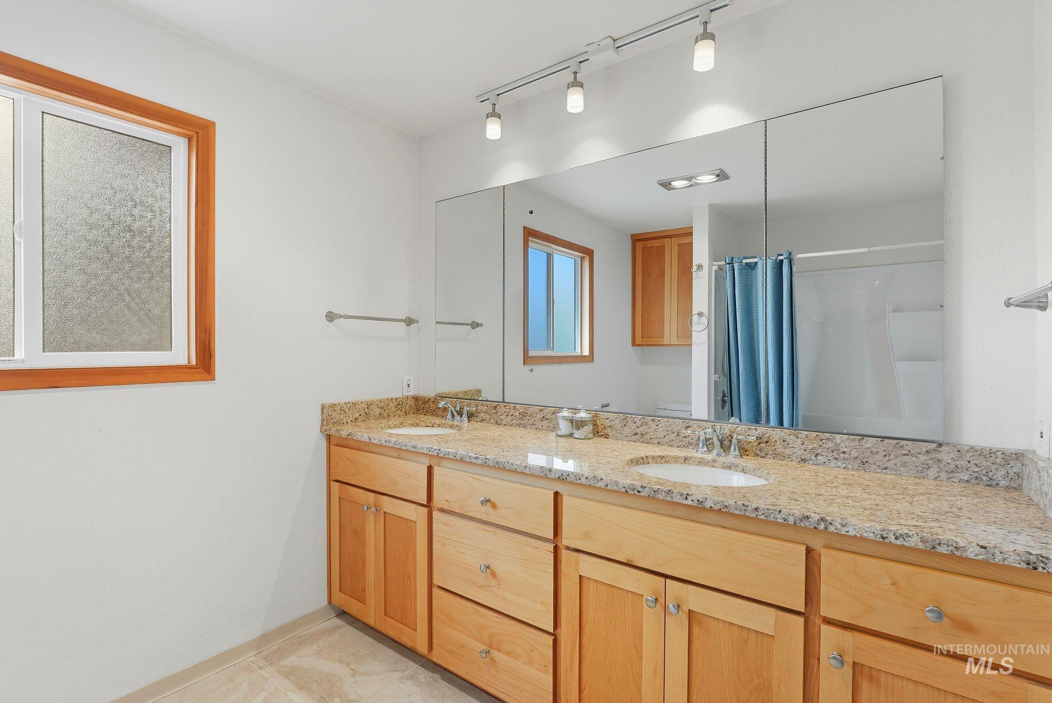 1101 5th Street Asotin, WA 99402 - Photo 21 of 48 Bathroom featuring double vanity and rail lighting