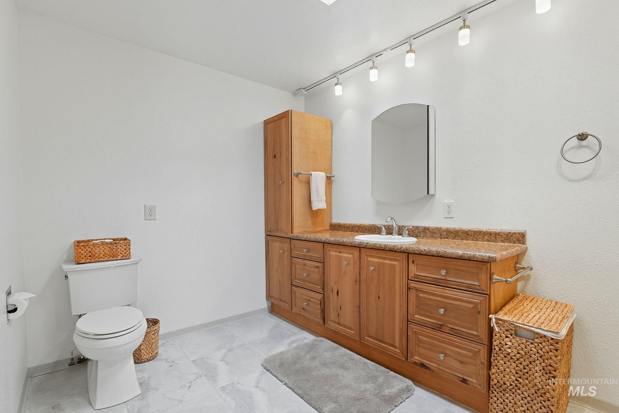 1101 5th Street Asotin, WA 99402 - Photo 29 of 48 Bathroom featuring vanity and track lighting