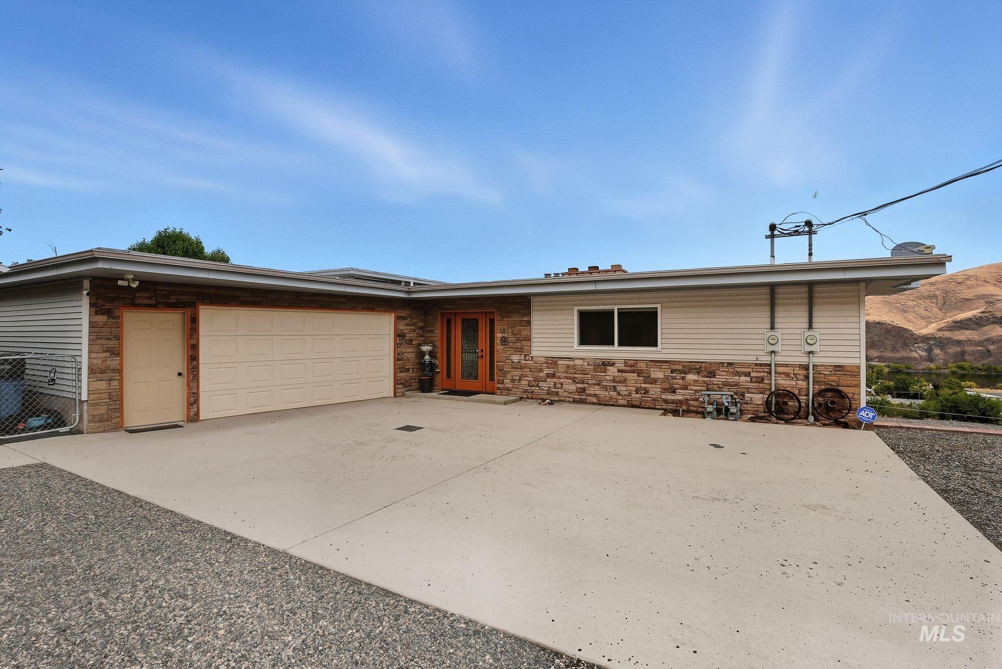 1101 5th Street Asotin, WA 99402 - Photo 3 of 48 Single story home featuring concrete driveway and an attached garage