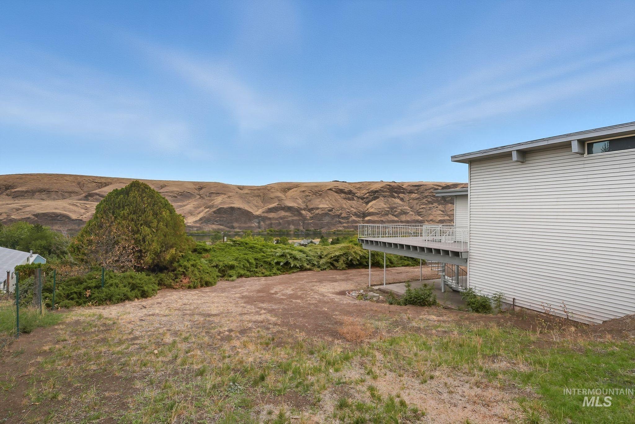 1101 5th Street Asotin, WA 99402 - Photo 44 of 48 View of yard featuring a deck with mountain view