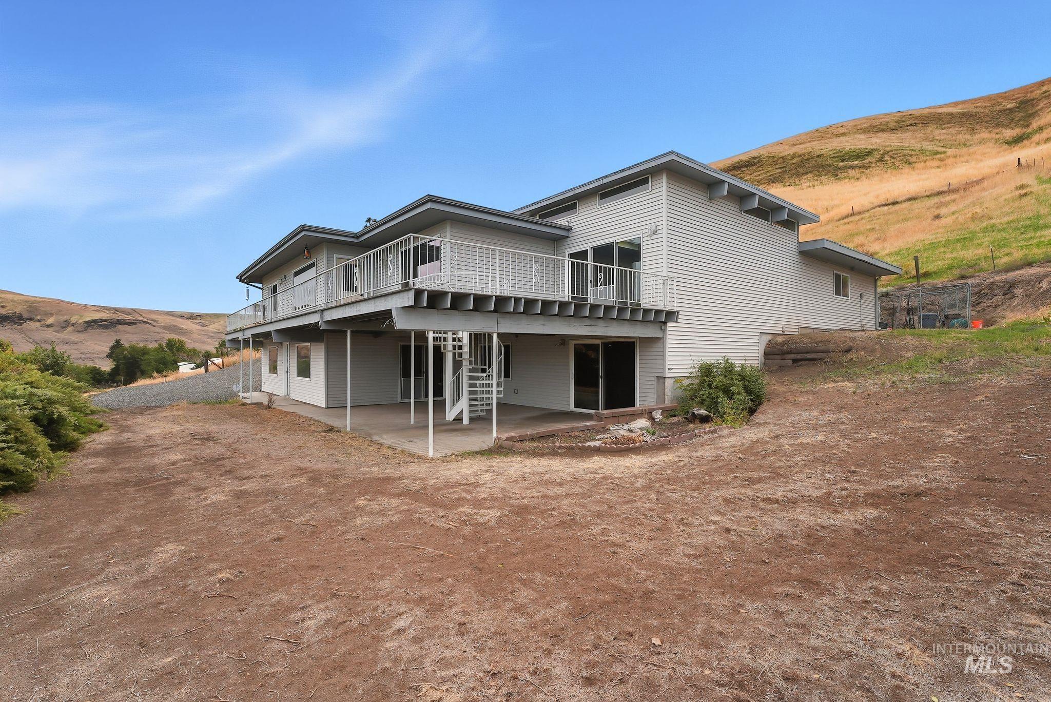1101 5th Street Asotin, WA 99402 - Photo 45 of 48 View of side of home featuring a patio area and a deck with mountain view