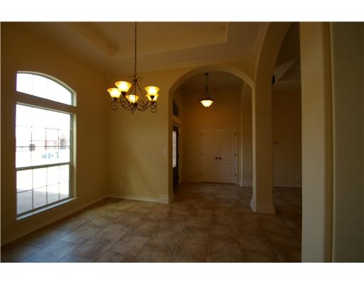 8210 Azimuth Court Corpus Christi, TX 78414 - Photo 2 of 10 a view of a livingroom with a chandelier