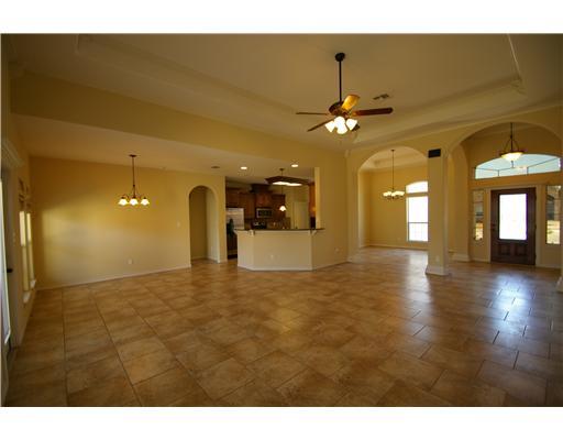 8210 Azimuth Court Corpus Christi, TX 78414 - Photo 3 of 10 a view of a room with a ceiling fan