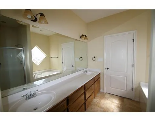 a bathroom with a sink vanity and a mirror