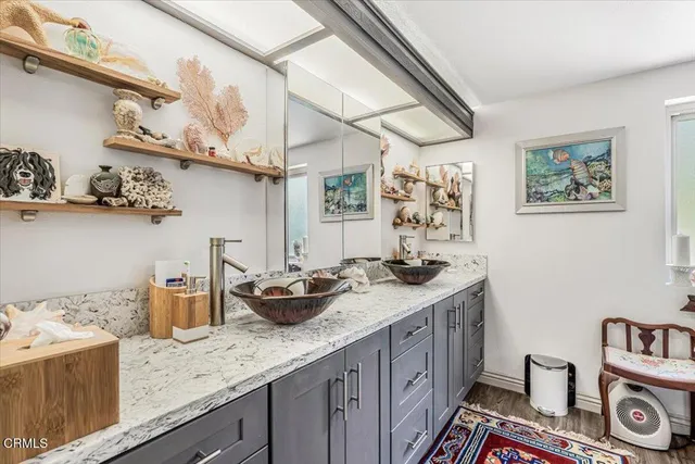 a kitchen with stainless steel appliances granite countertop a sink and cabinets