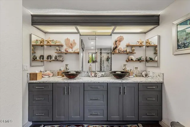 a kitchen with stainless steel appliances a sink and cabinets