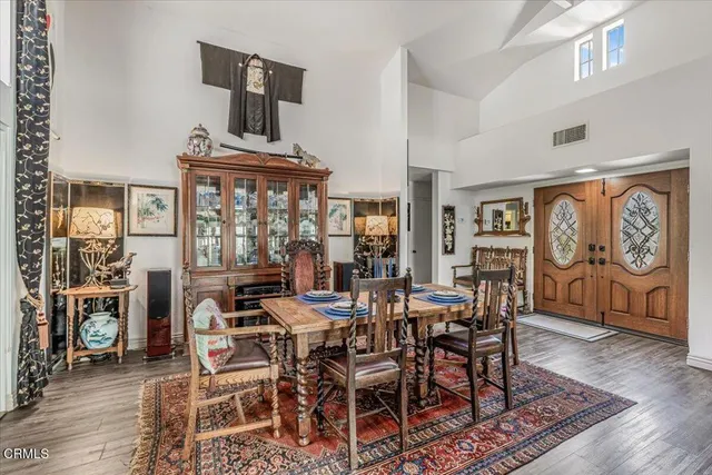 a view of a dining room with furniture window and wooden floor