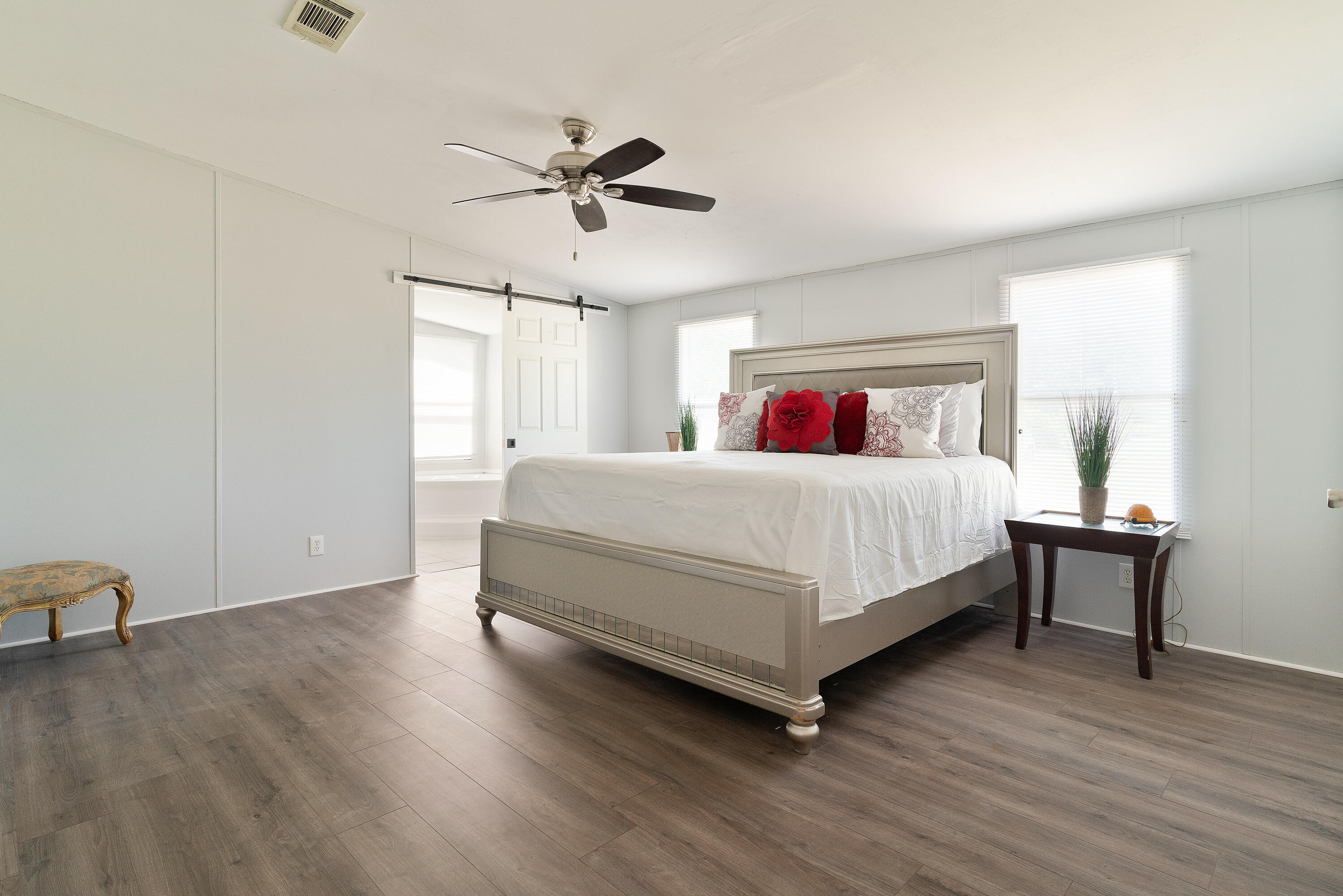 1032 Whitehead Drive Holt, FL 32564 - Photo 13 of 40 a bedroom with a bed and a table