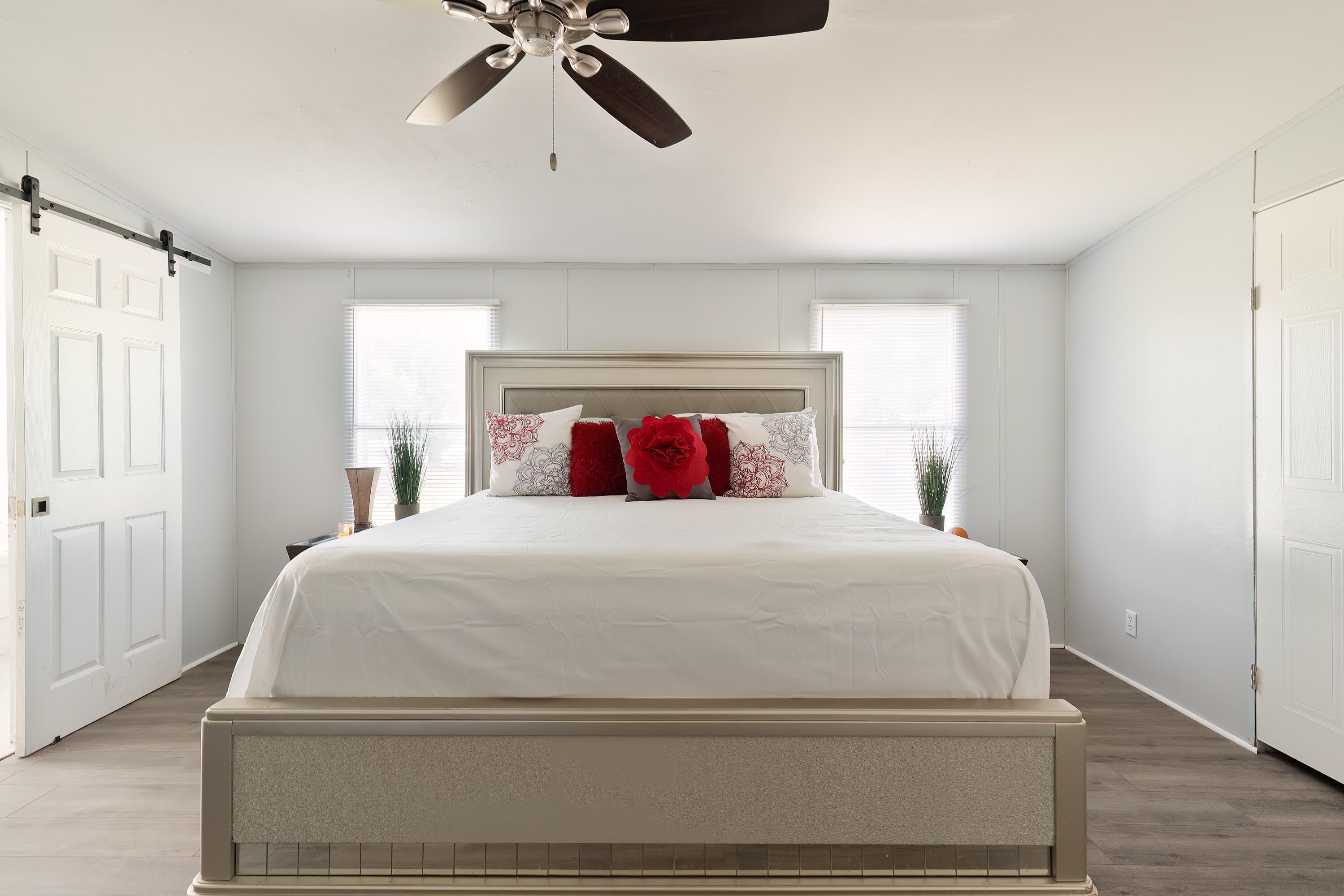 1032 Whitehead Drive Holt, FL 32564 - Photo 14 of 40 a bedroom with a bed and wooden floor