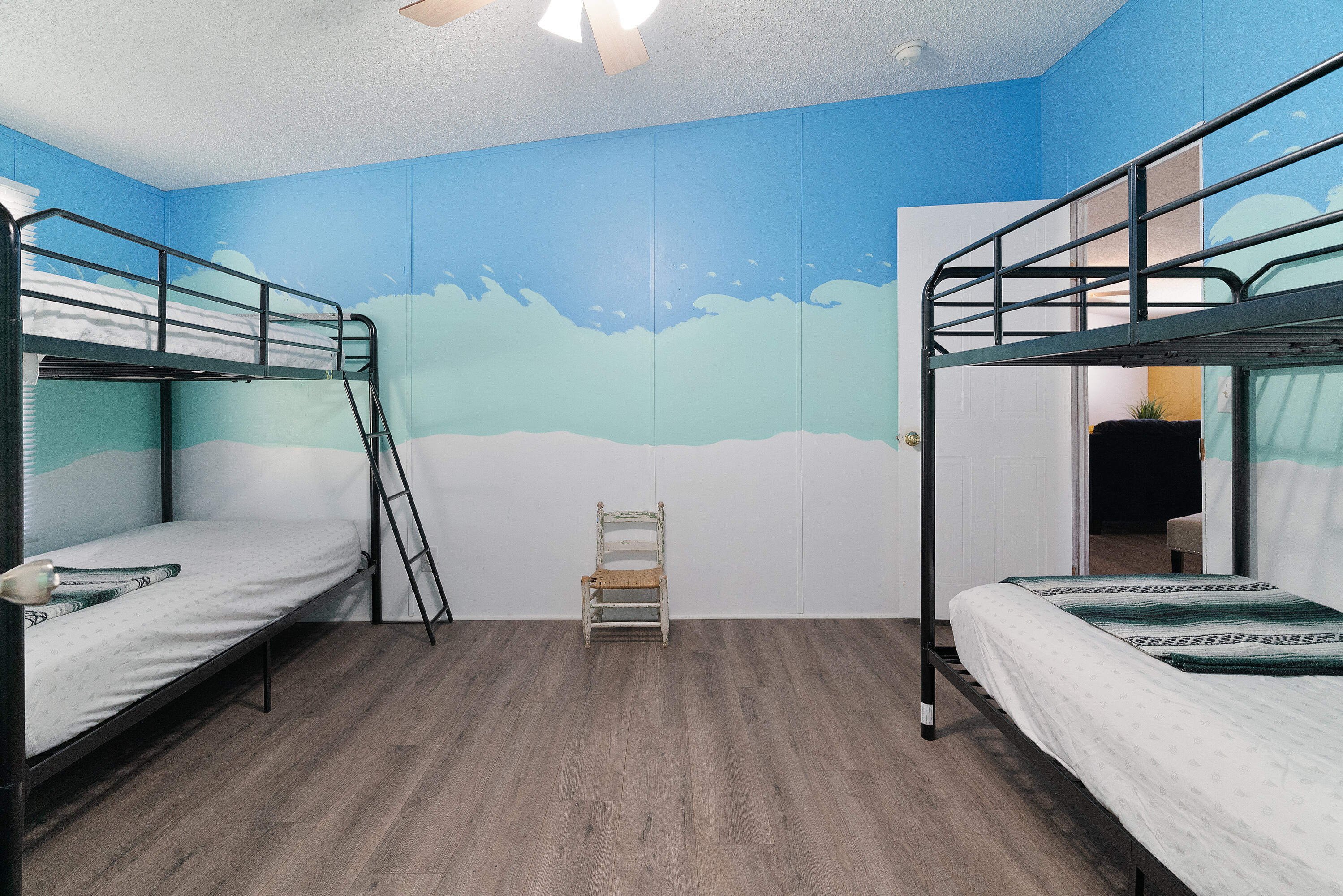 1032 Whitehead Drive Holt, FL 32564 - Photo 18 of 40 a bedroom with a bed and a mirror