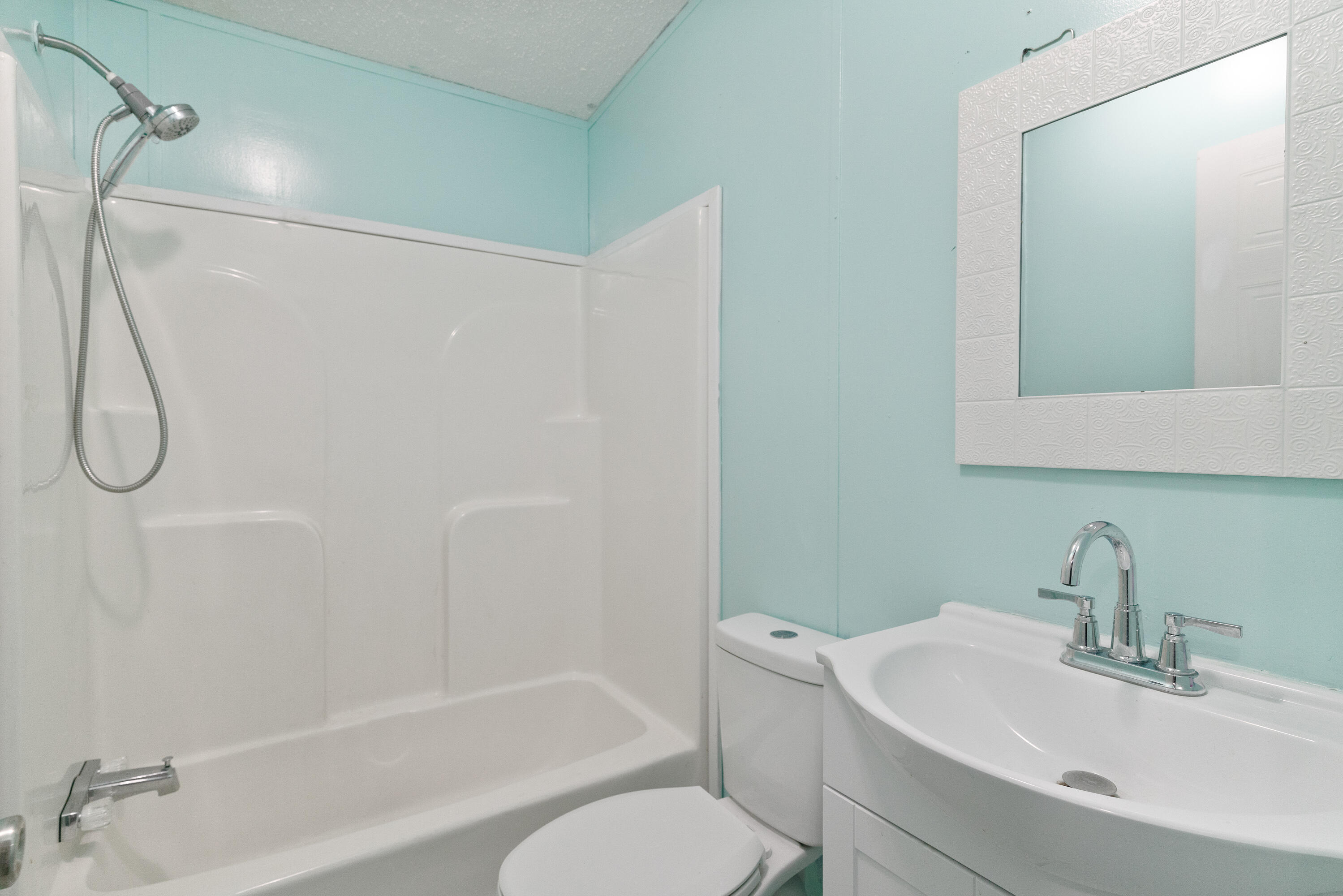 1032 Whitehead Drive Holt, FL 32564 - Photo 24 of 40 a bathroom with a granite countertop sink toilet and shower