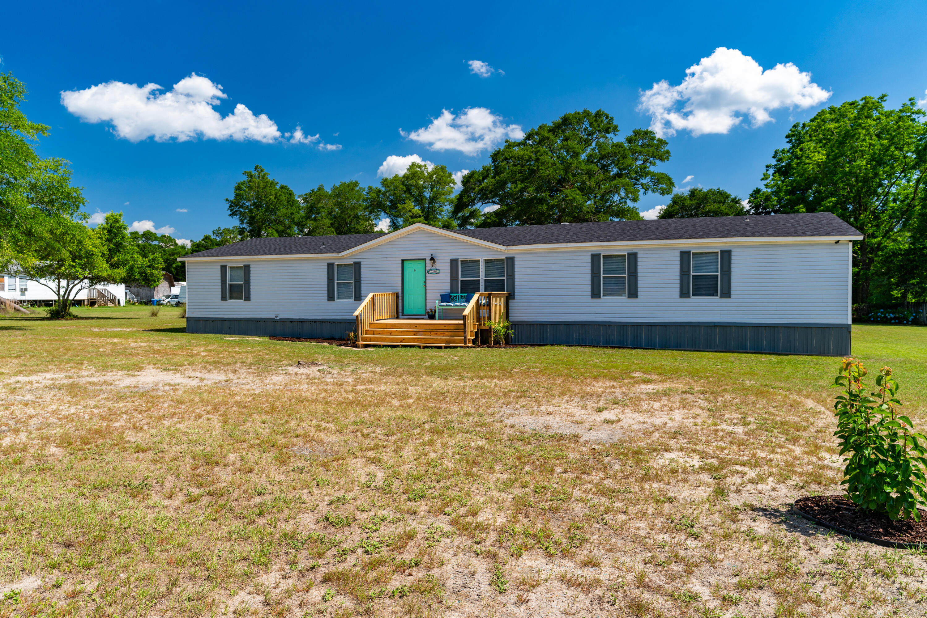 1032 Whitehead Drive Holt, FL 32564 - Photo 31 of 40 a view of a house with a backyard