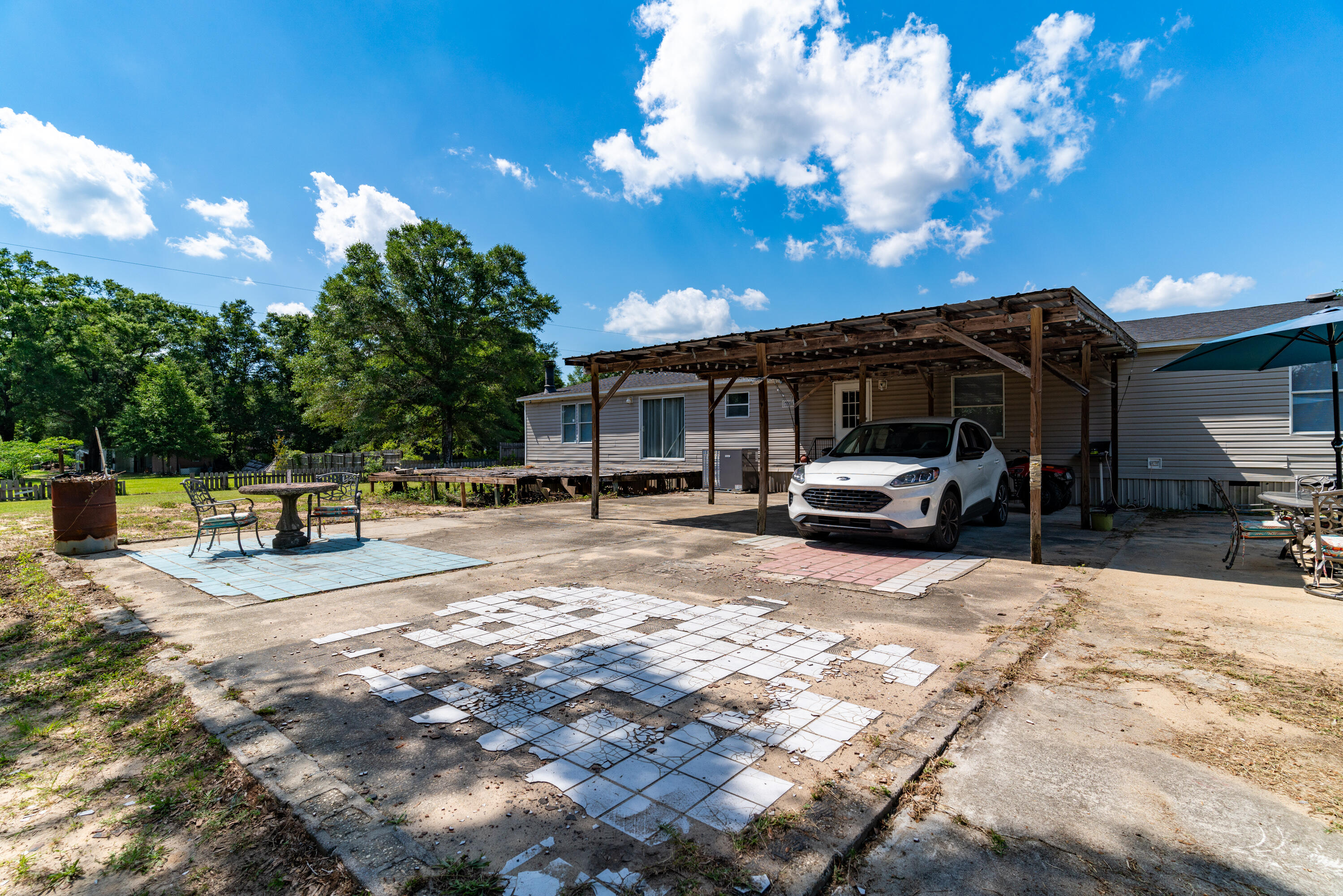 1032 Whitehead Drive Holt, FL 32564 - Photo 34 of 40 a view of a house with a patio