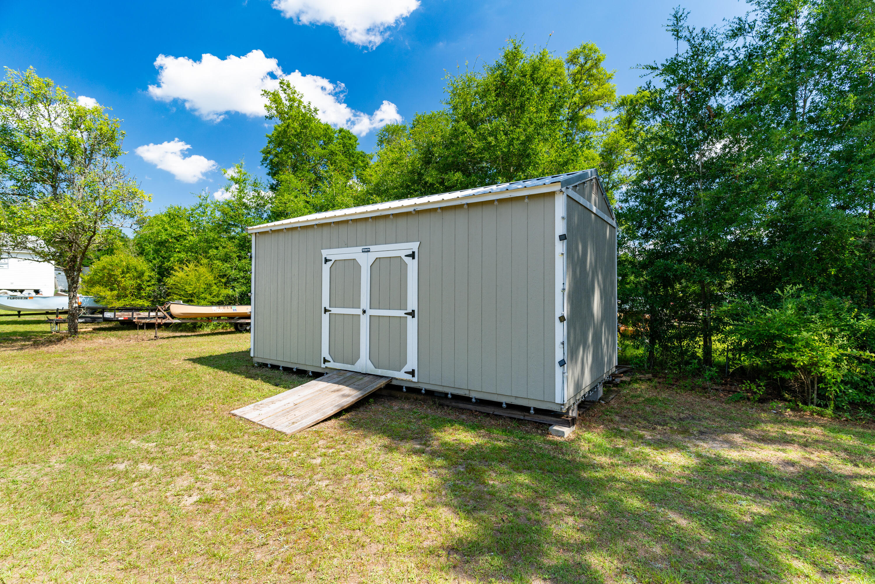 1032 Whitehead Drive Holt, FL 32564 - Photo 35 of 40 a view of a backyard with swimming pool