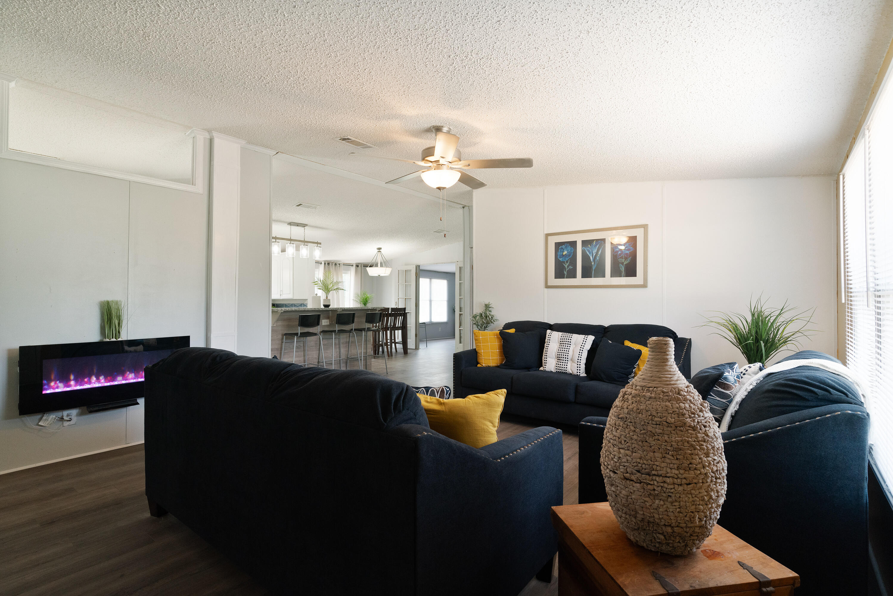 1032 Whitehead Drive Holt, FL 32564 - Photo 4 of 40 a living room with furniture and a chandelier