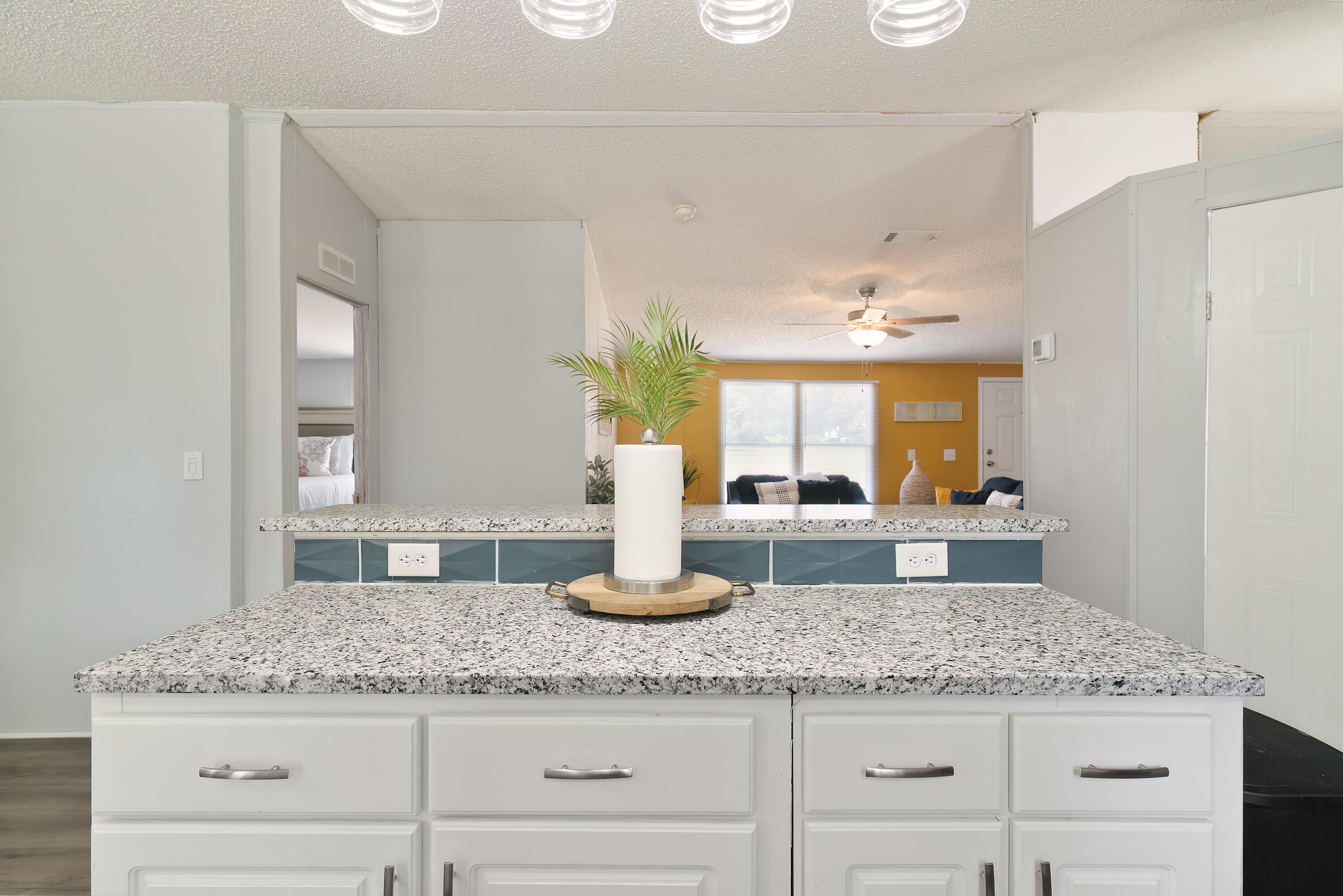 1032 Whitehead Drive Holt, FL 32564 - Photo 7 of 40 a bathroom with a granite countertop sink and a mirror